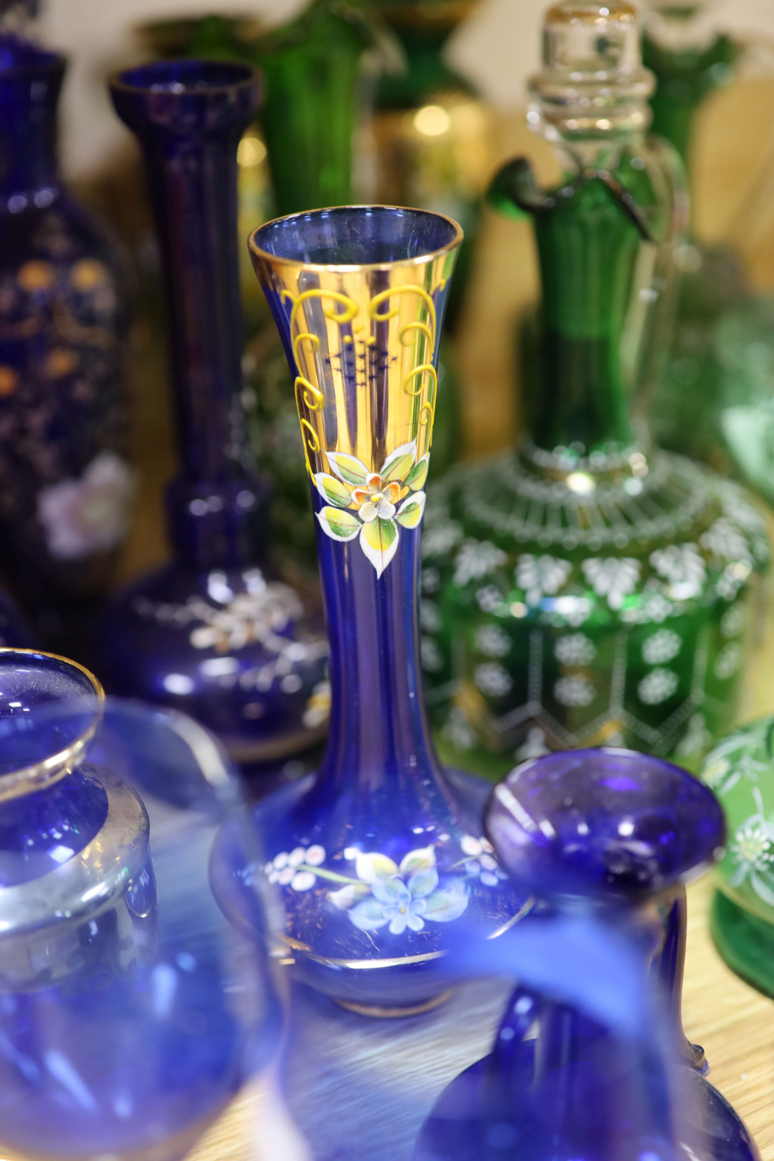 A collection of gilded blue and green glass, Bohemian and other glass